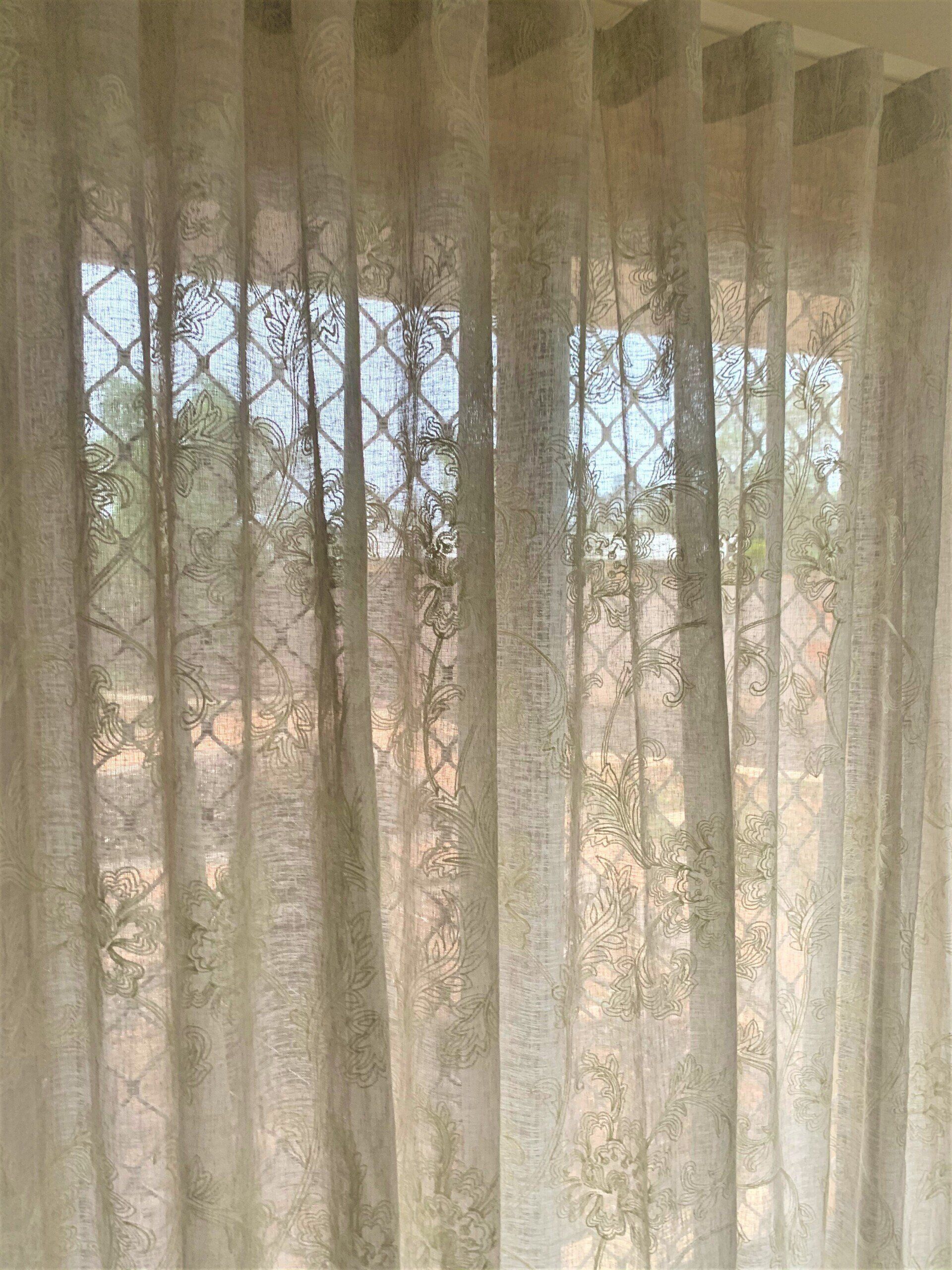 Sheer Beige Curtains in Front of A Window — Alice Mobile Blinds in Ciccone, NT