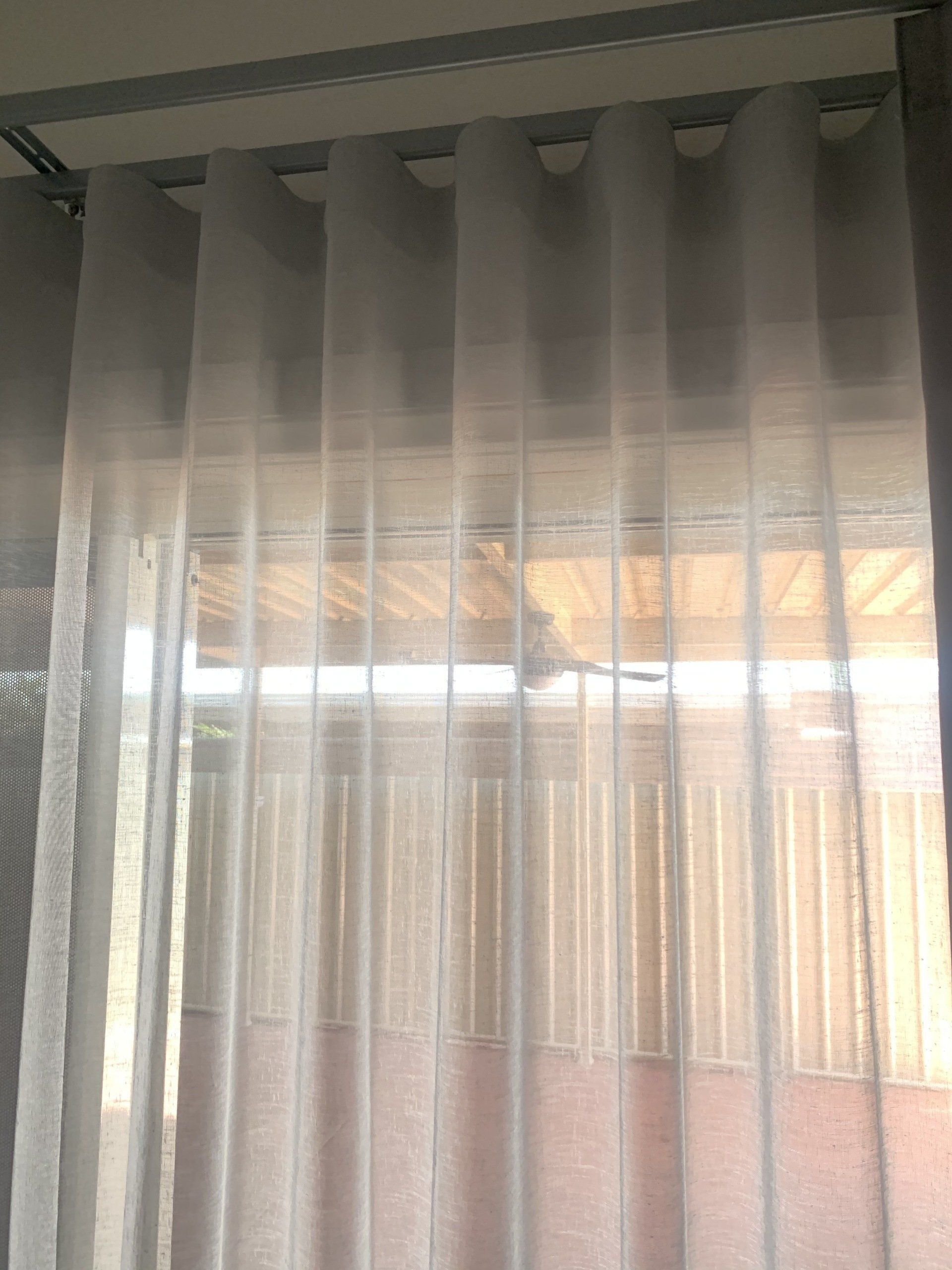 Sheer White Curtains Hanging in Front of A Window — Alice Mobile Blinds in Ciccone, NT