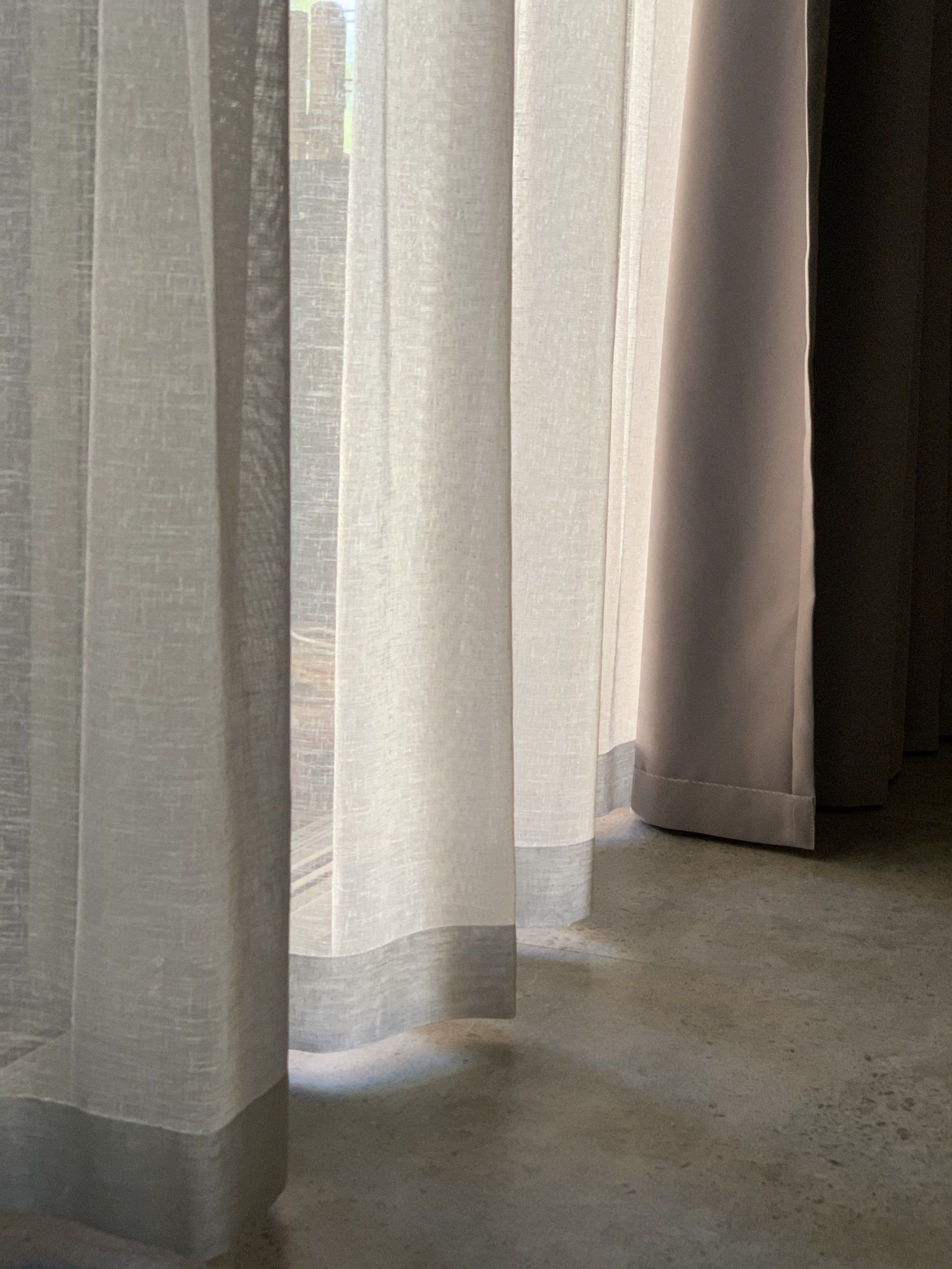Sheer White Curtains Partially Obscuring a Window — Alice Mobile Blinds in Ciccone, NT