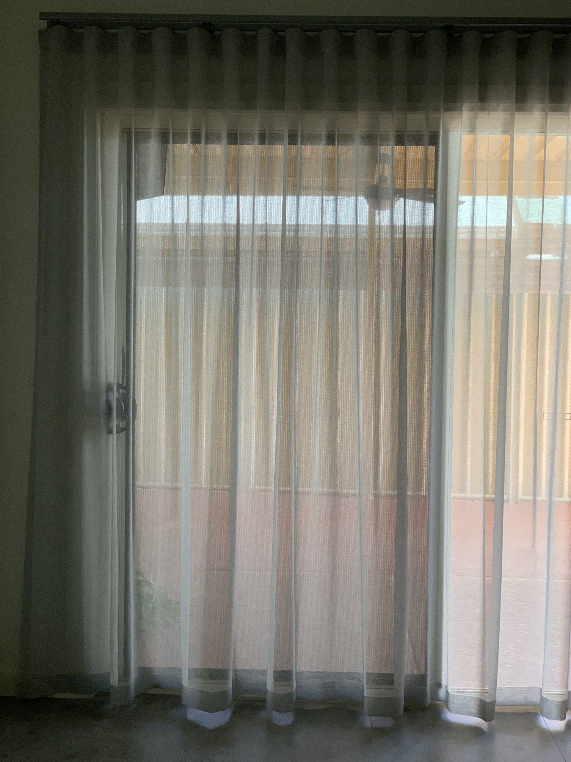 Sheer White Curtains Covering a Sliding Glass Door — Alice Mobile Blinds in Ciccone, NT
