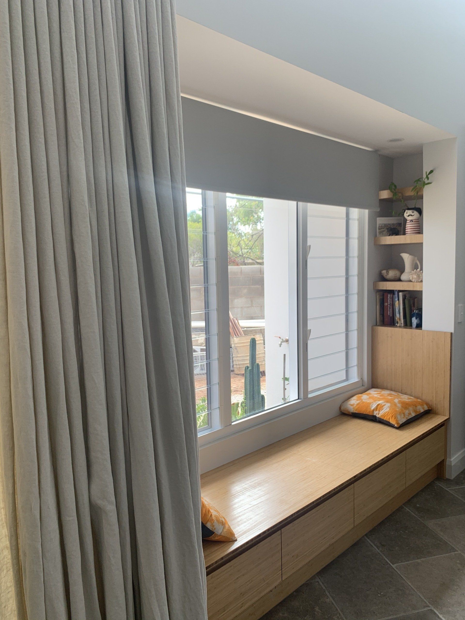 A Built-In Window Seat with Light Wood — Alice Mobile Blinds in Ciccone, NT
