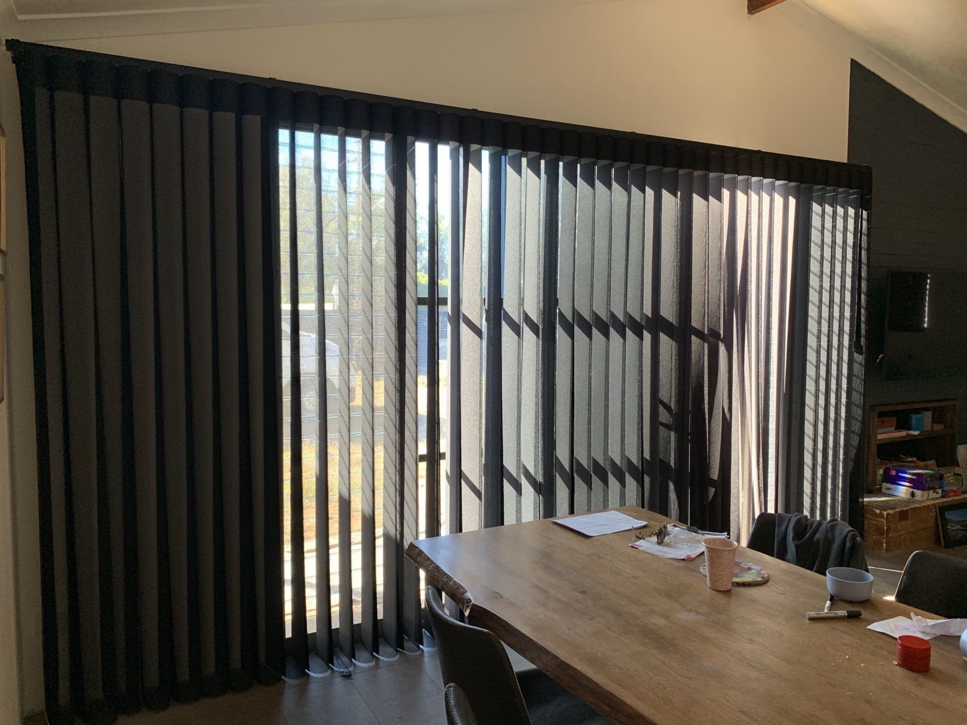 Sliding Glass Doors with Dark Vertical Blinds — Alice Mobile Blinds in Ciccone, NT