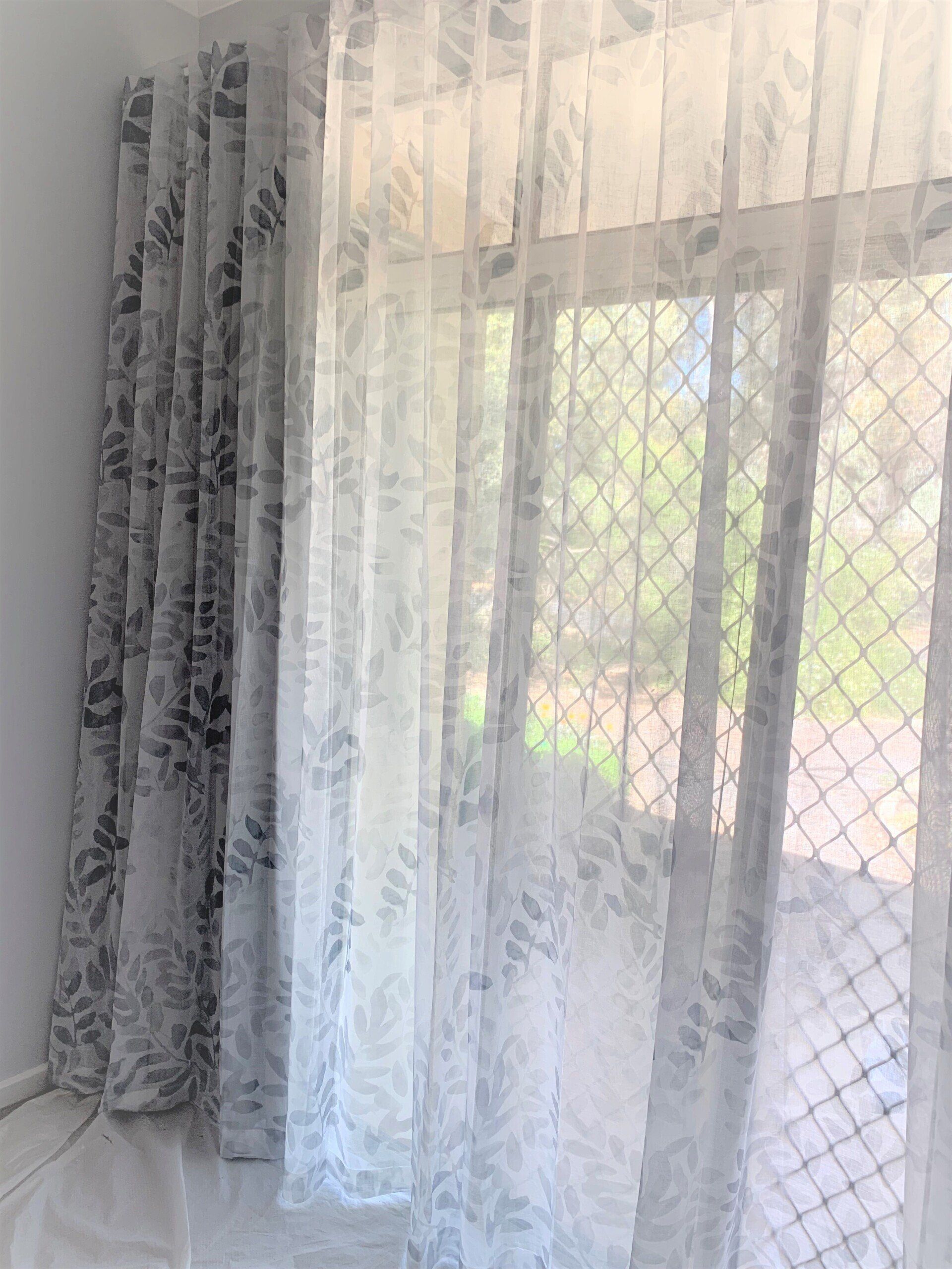 Grey and White Patterned Curtains Covering a Window — Alice Mobile Blinds in Ciccone, NT