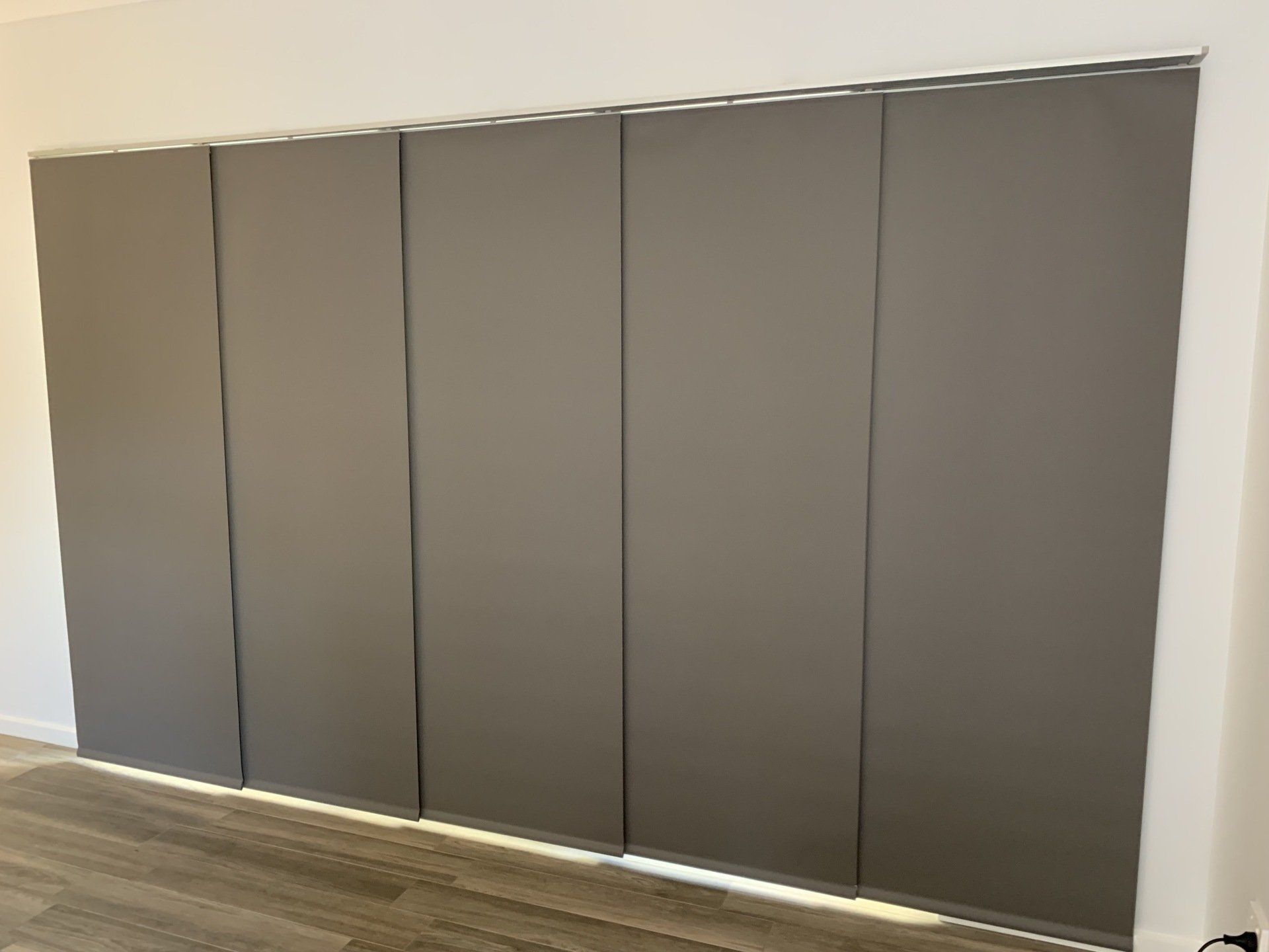 Grey Panel Blinds Covering a Large Window — Alice Mobile Blinds in Ciccone, NT