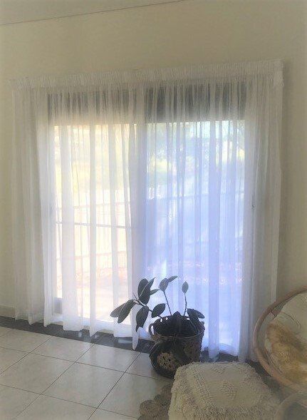 White Sheer Curtains Over a Window — Alice Mobile Blinds in Ciccone, NT