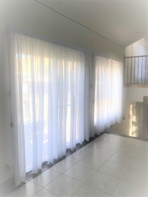 Sheer White Curtains on A Window Inside a Bright Room — Alice Mobile Blinds in Ciccone, NT