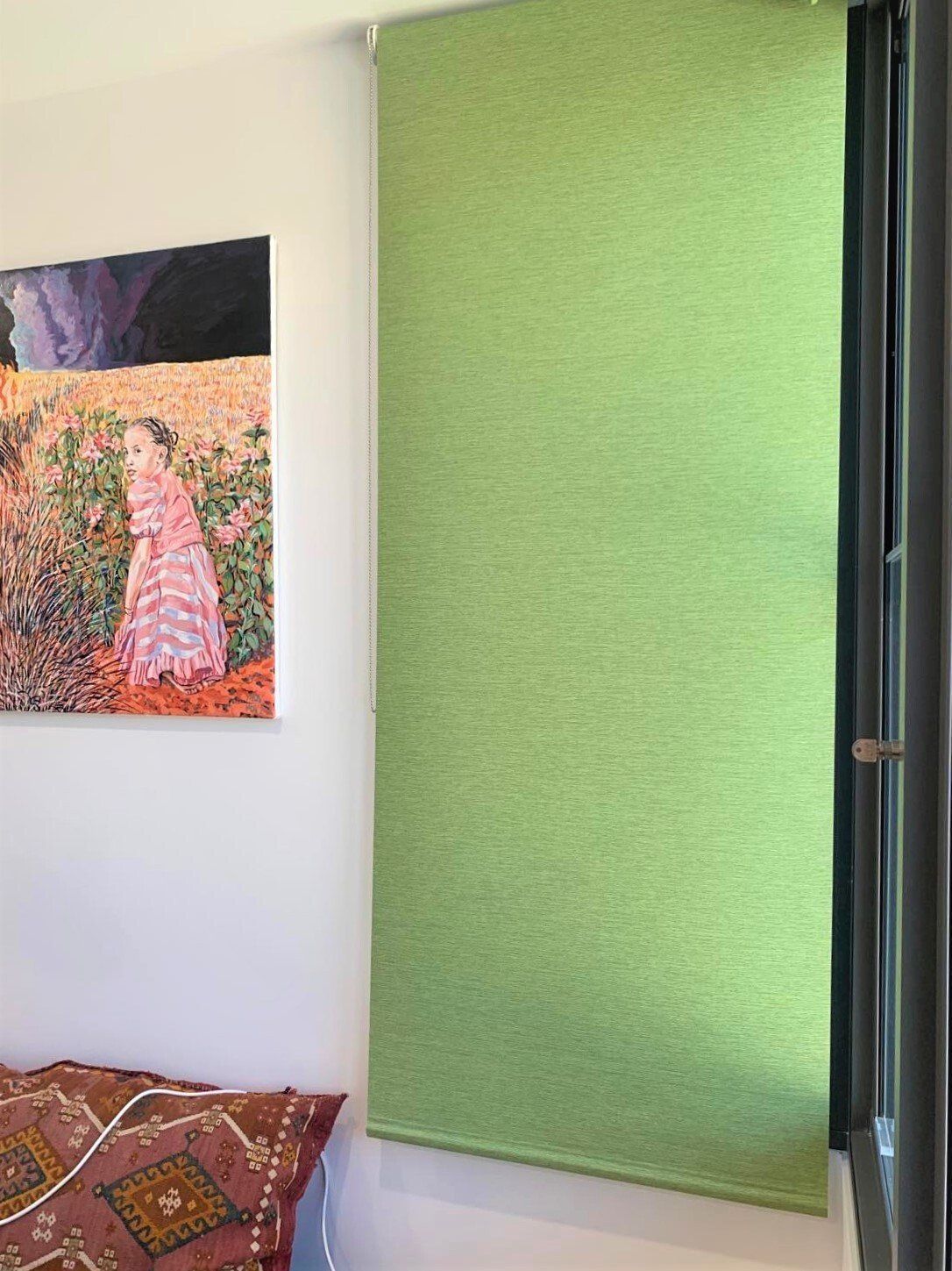 Green Window Shade Next to A Painting and Cushion — Alice Mobile Blinds in Ciccone, NT