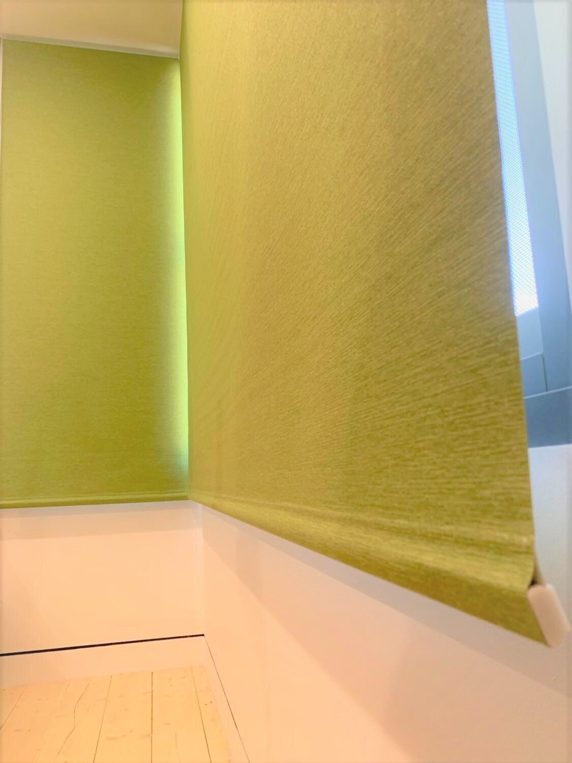 Green Blinds Cover Windows with A White Sill — Alice Mobile Blinds in Ciccone, NT