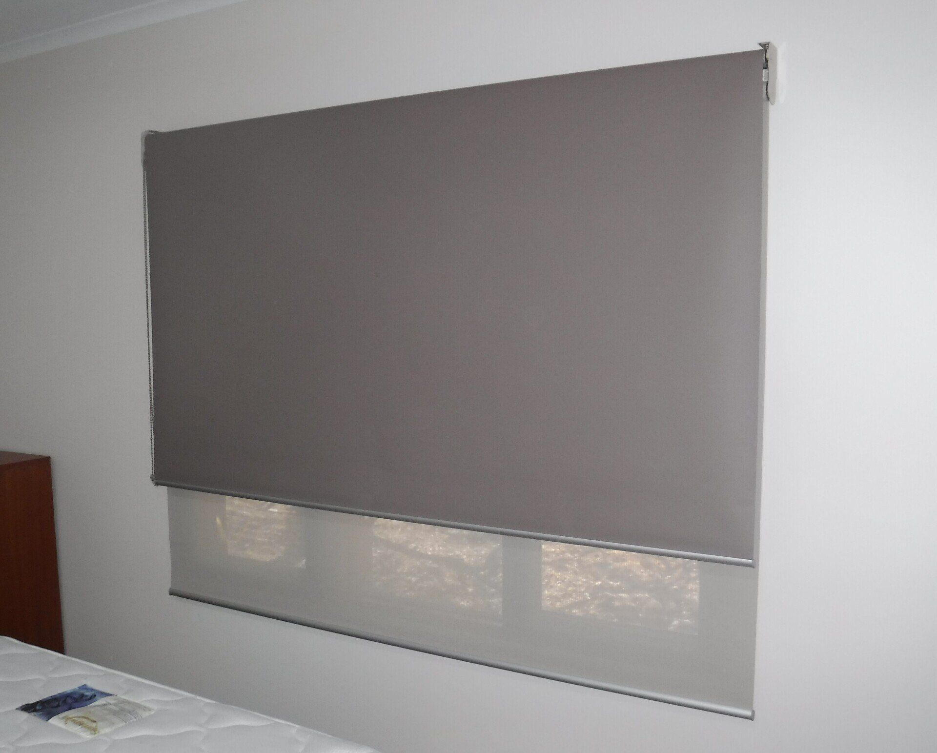 Grey Roller Shades Covering a Window — Alice Mobile Blinds in Ciccone, NT
