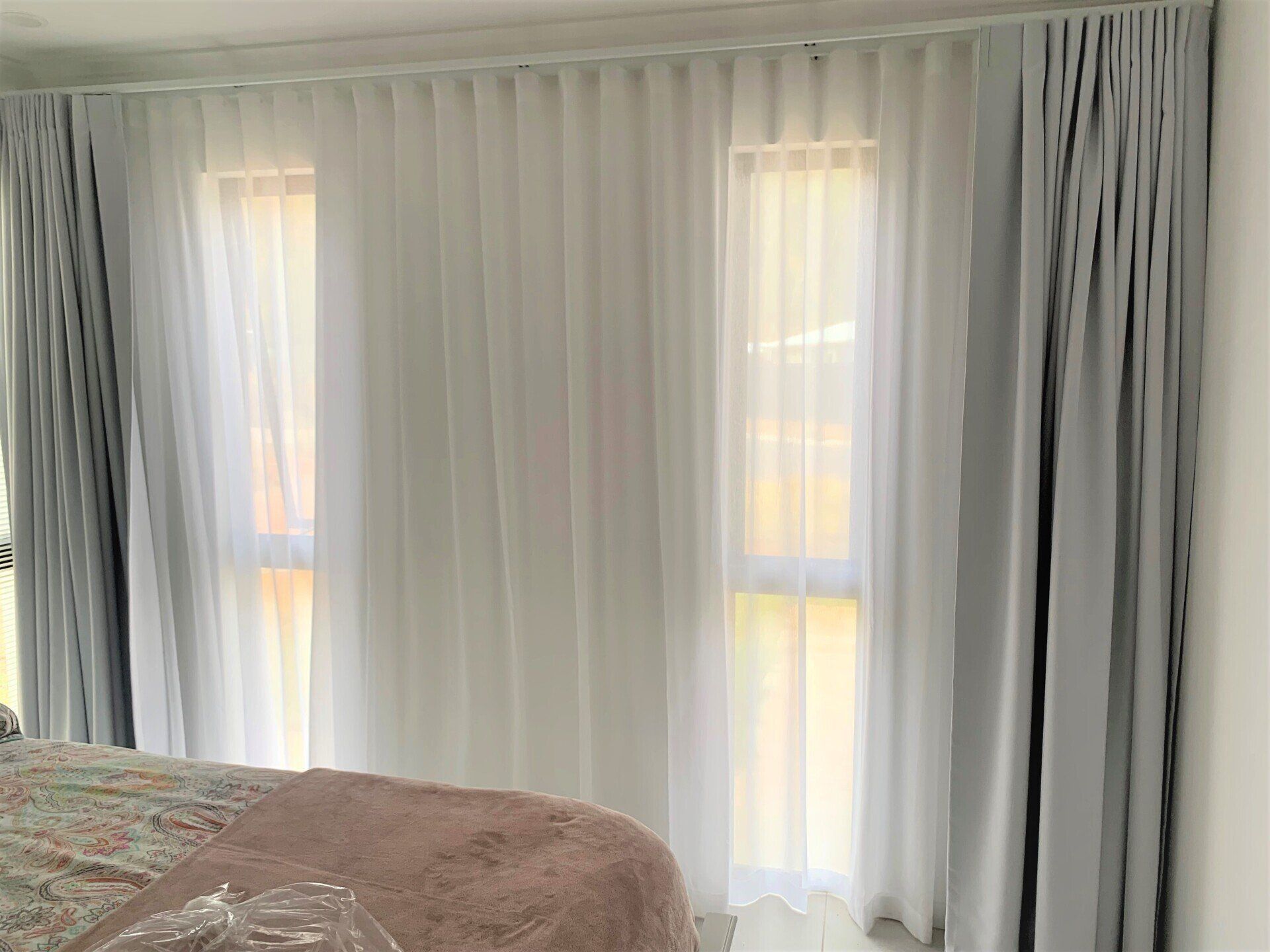 Room with Light Grey and White Curtains — Alice Mobile Blinds in Ciccone, NT