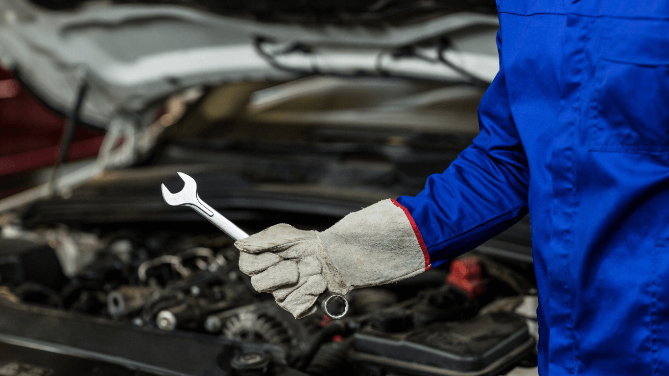 mechanic with a wrench in hand