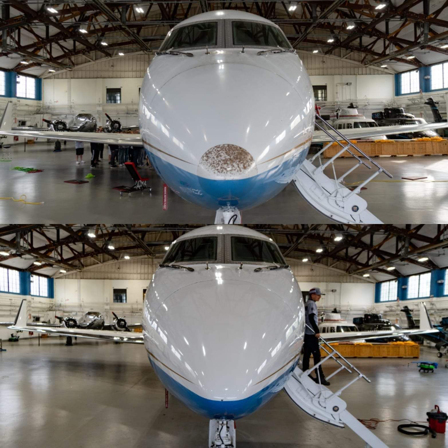 A blue and white airplane is parked in a hangar