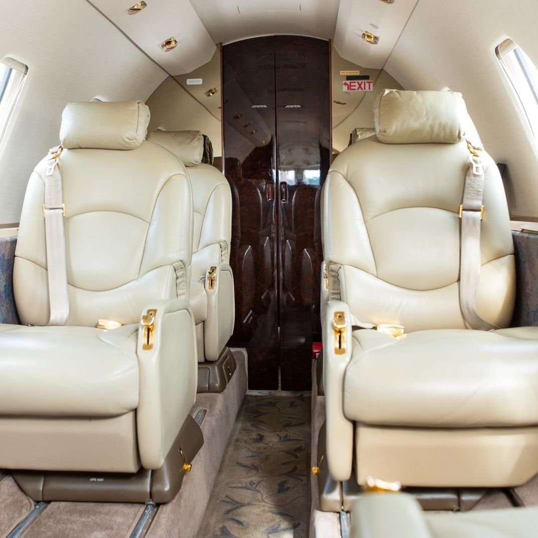The inside of a plane with a sign that says exit