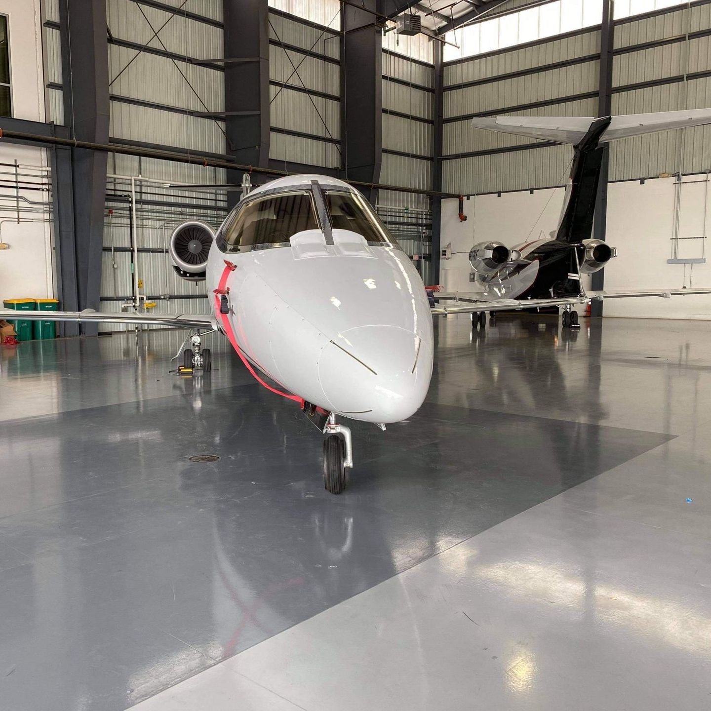 A small airplane is parked in a hangar.