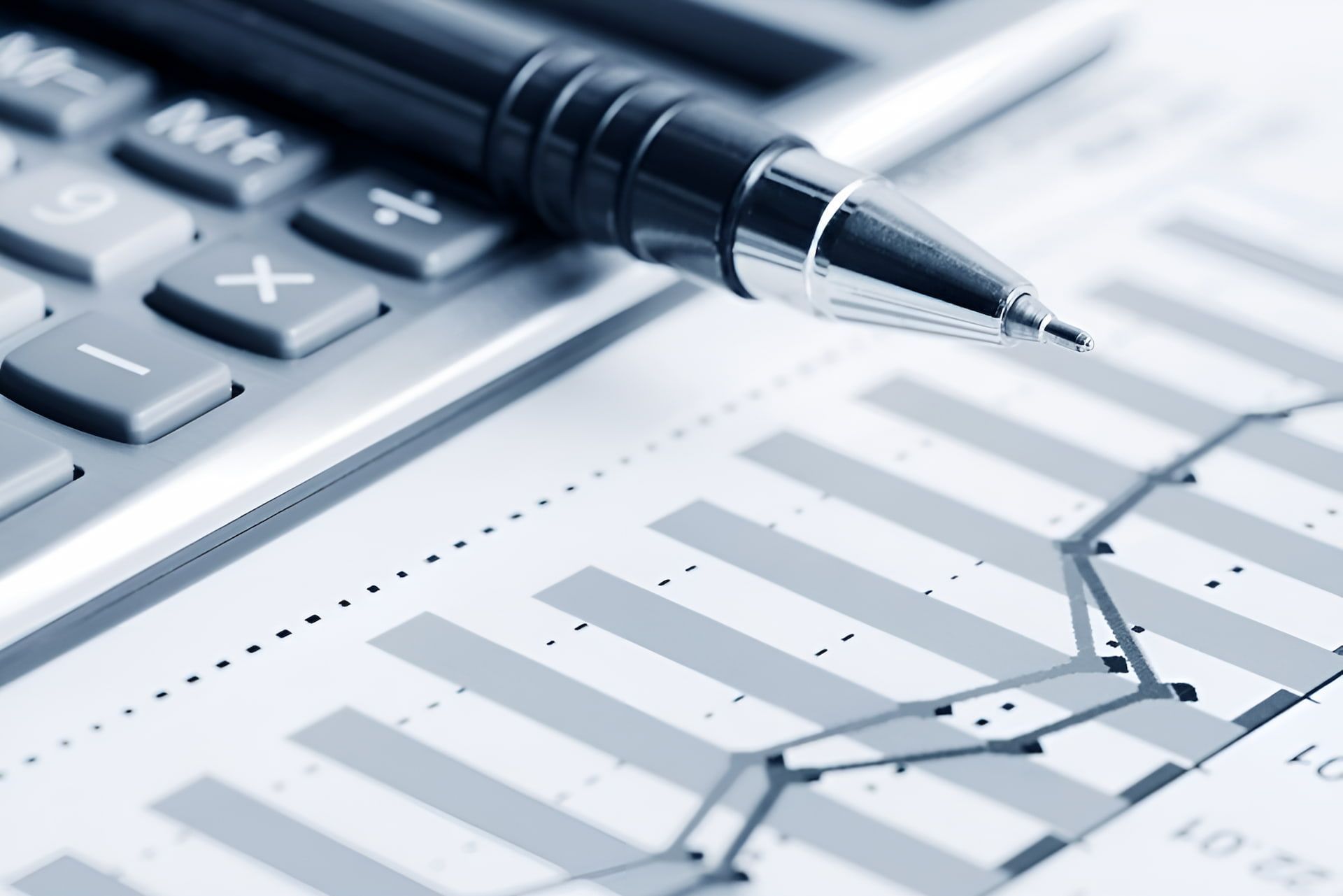 A Pen Is Sitting On Top Of A Calculator And A Graph — BookSenz In Aberglasslyn, NSW