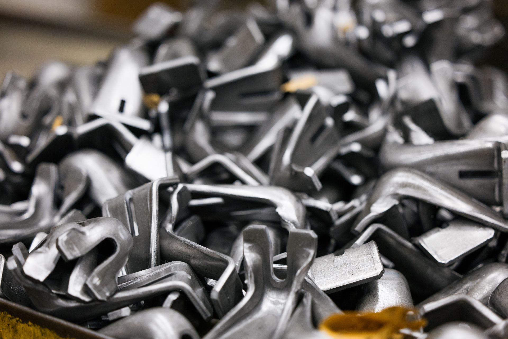 A pile of metal pieces sitting on top of each other on a table.