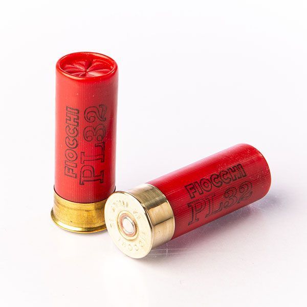 Three brass bullets with copper tops on a white background