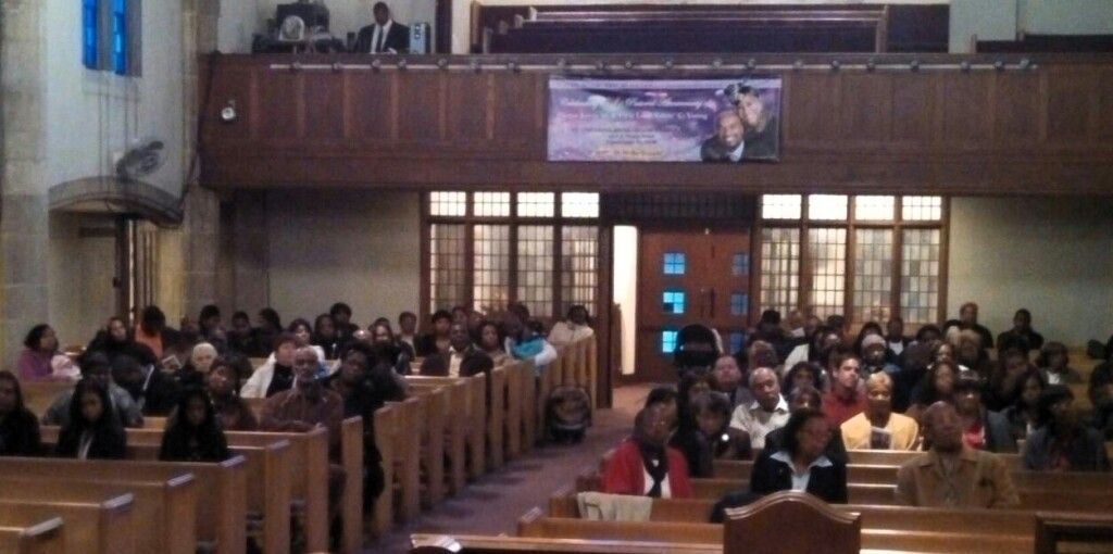 A large group of people are sitting in a church