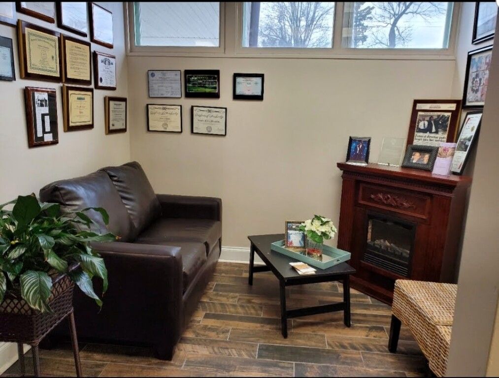 A living room with a fireplace and a couch