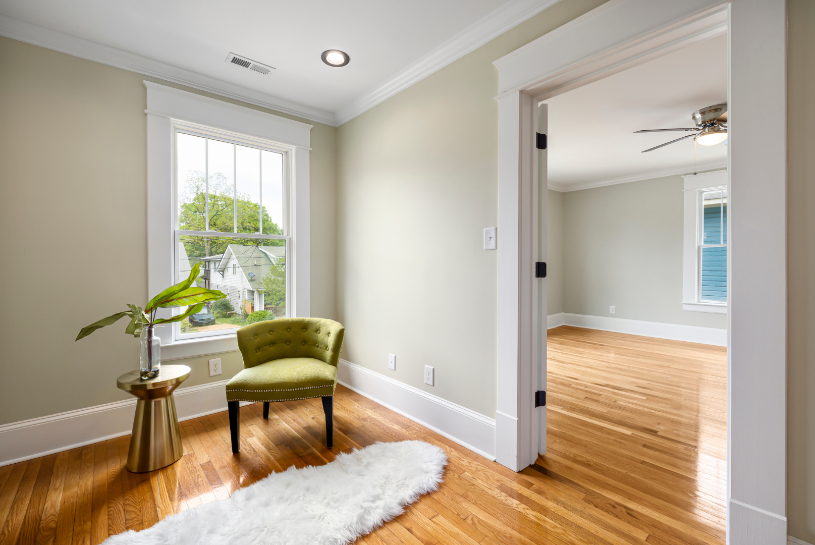 There is a chair and a rug in the room.