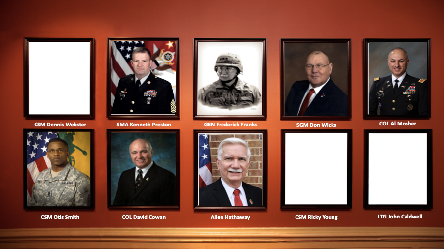 A collage of military and civilian portraits on a wall