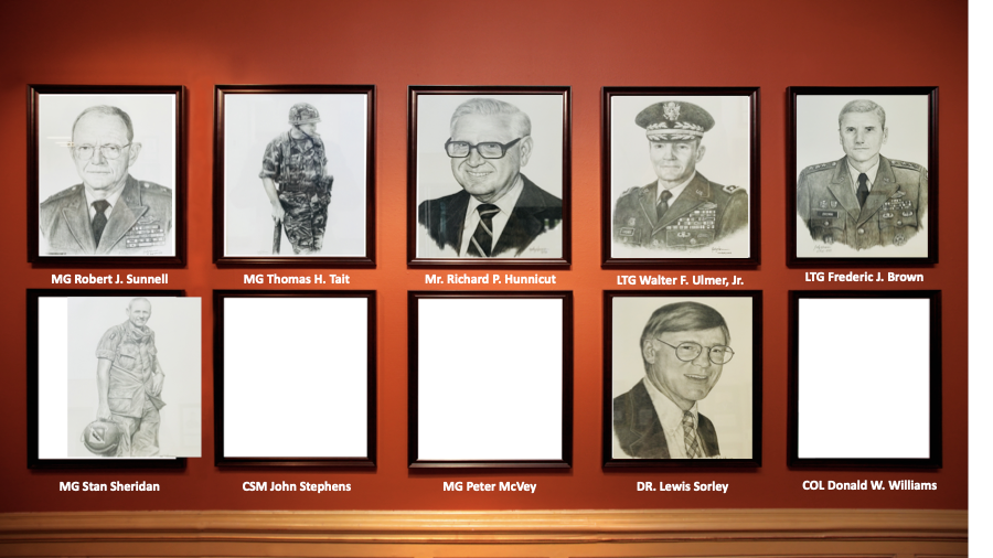 A row of portraits of men are hanging on a wall.