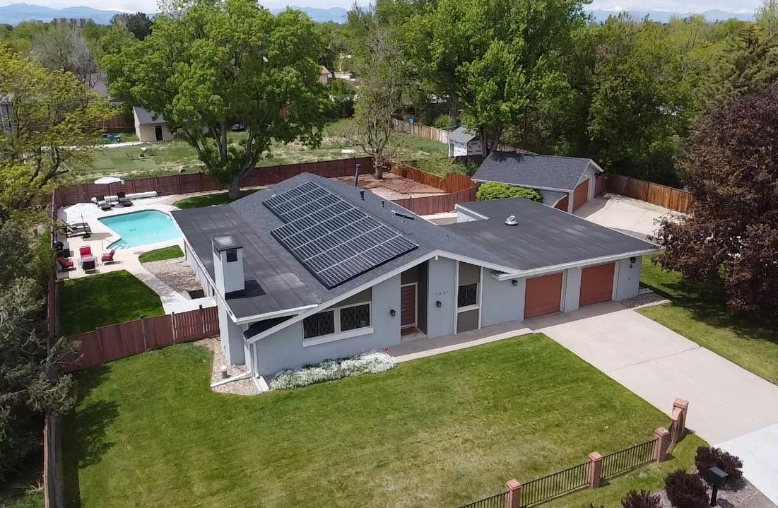 Elegant slate shingle roofing by Kudu Roofing.