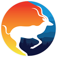 A woman in a blue shirt is smiling for the camera.