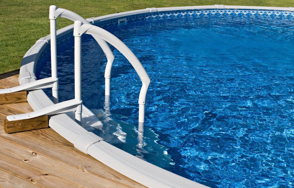 A Swimming Pool With Stairs Leading Up To It — Holiday Coast Pools & Water In Coffs Harbour, NSW