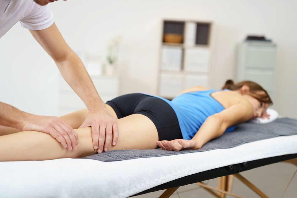 Leg Massage Therapy Indoors — Living Well Chiropractic Coffs Harbour in Coffs Harbour, NSW