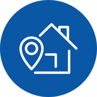 An icon of a house with a location pin on it in a blue circle .