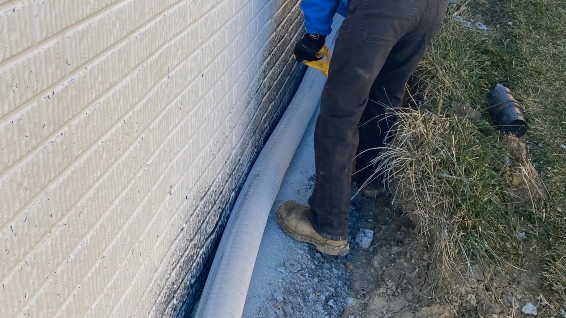 A machine is cutting a piece of metal in the ground