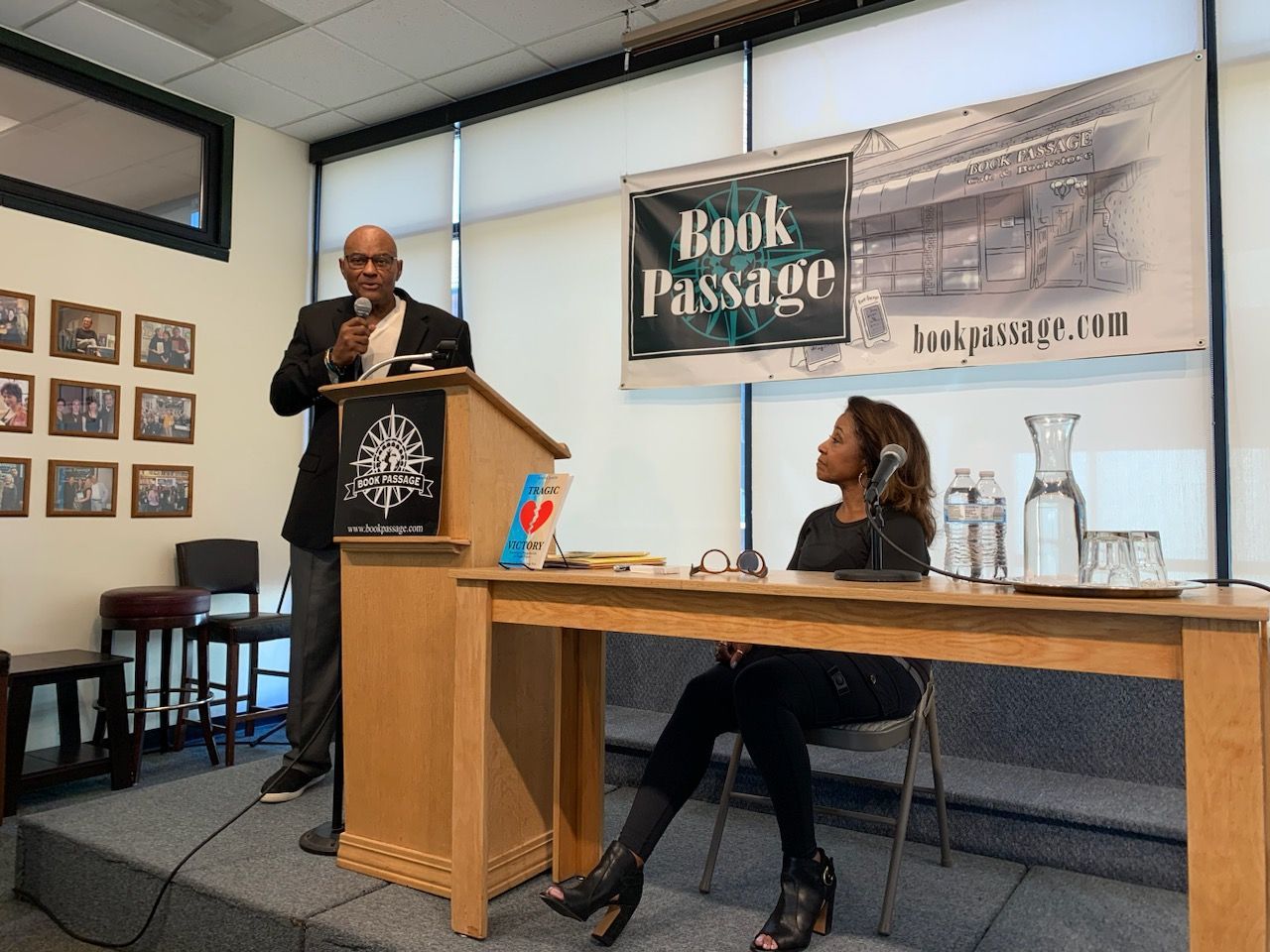 Diane's husband Ron is giving a speech at a book passage event