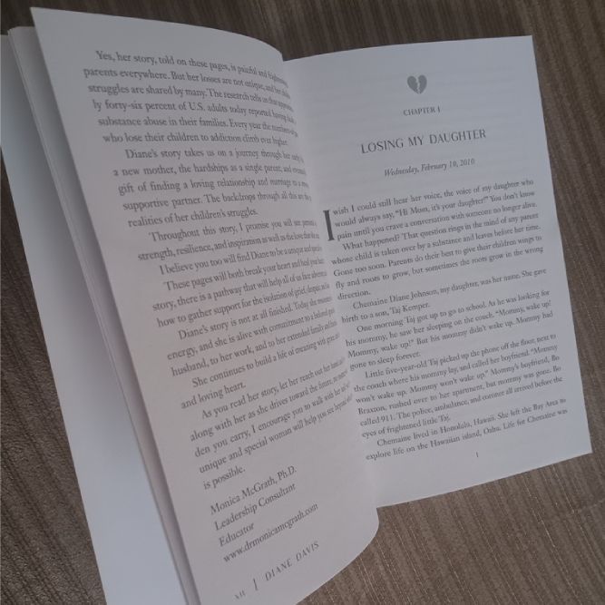 A book is open to a page titled loving my daughter