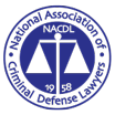 Logo of the National Association of Criminal Defense Lawyers: Scales inside a blue circle with white text.