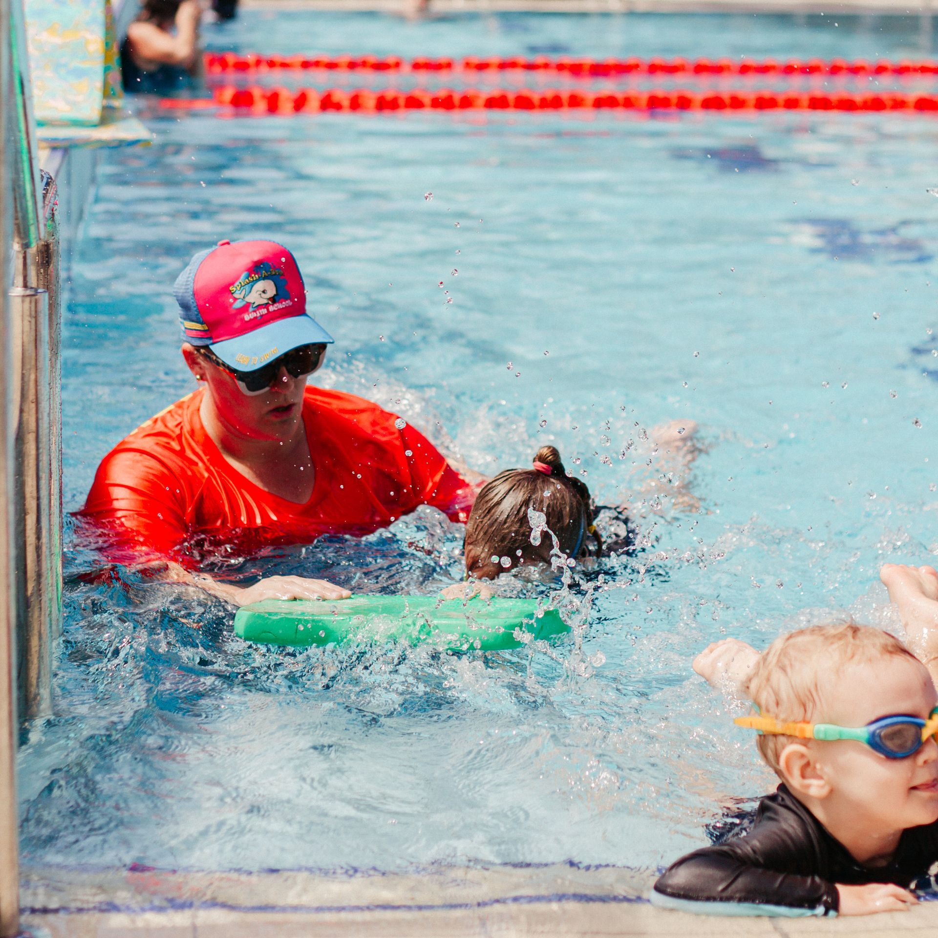 Little Girl In Pool Learning How To Swim In Swimming Pool — Splash-A-Bout Swim School Pty Ltd In Park Avenue, QLD