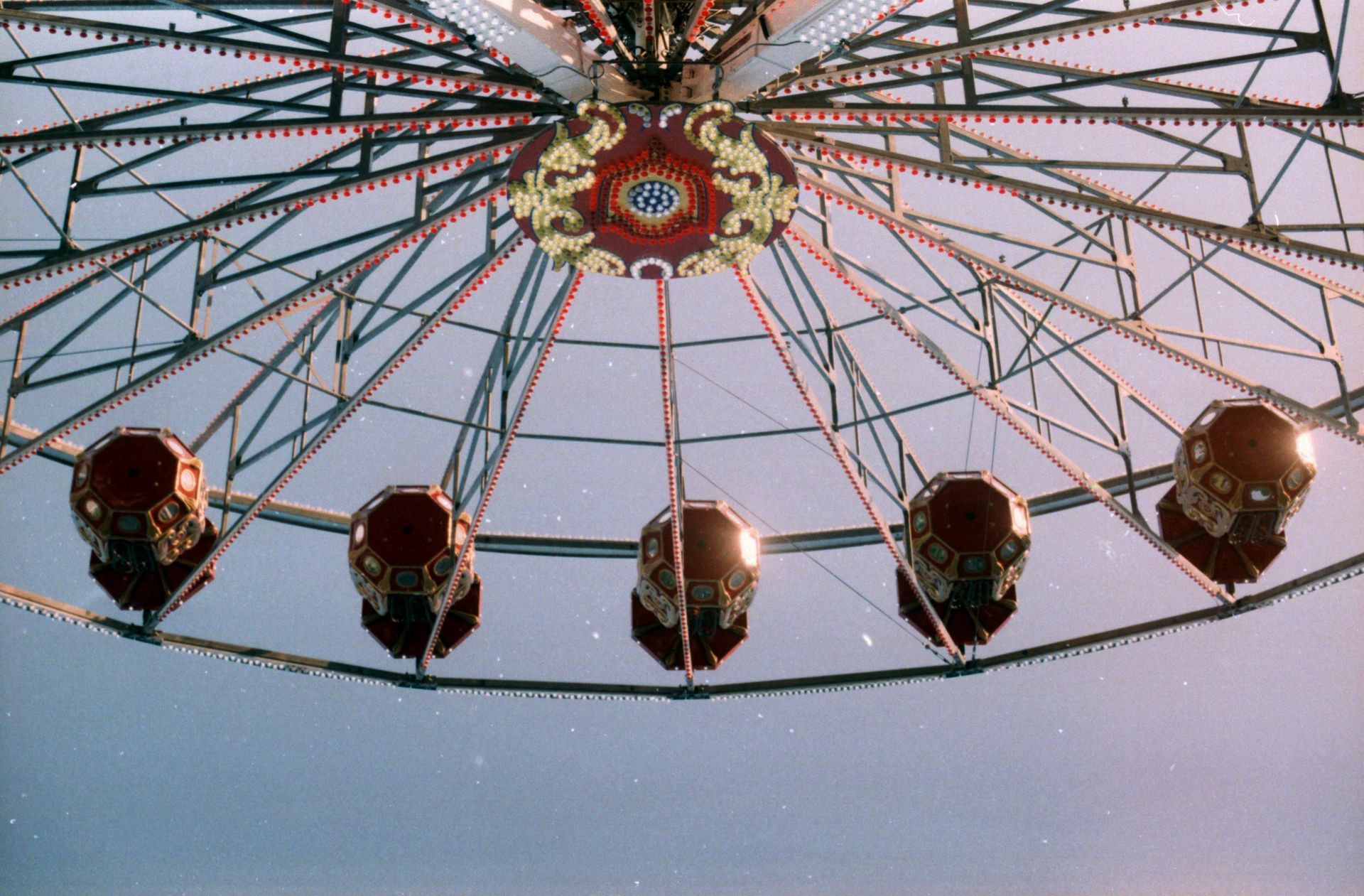 Looking up at a ferris wheel at an amusement park