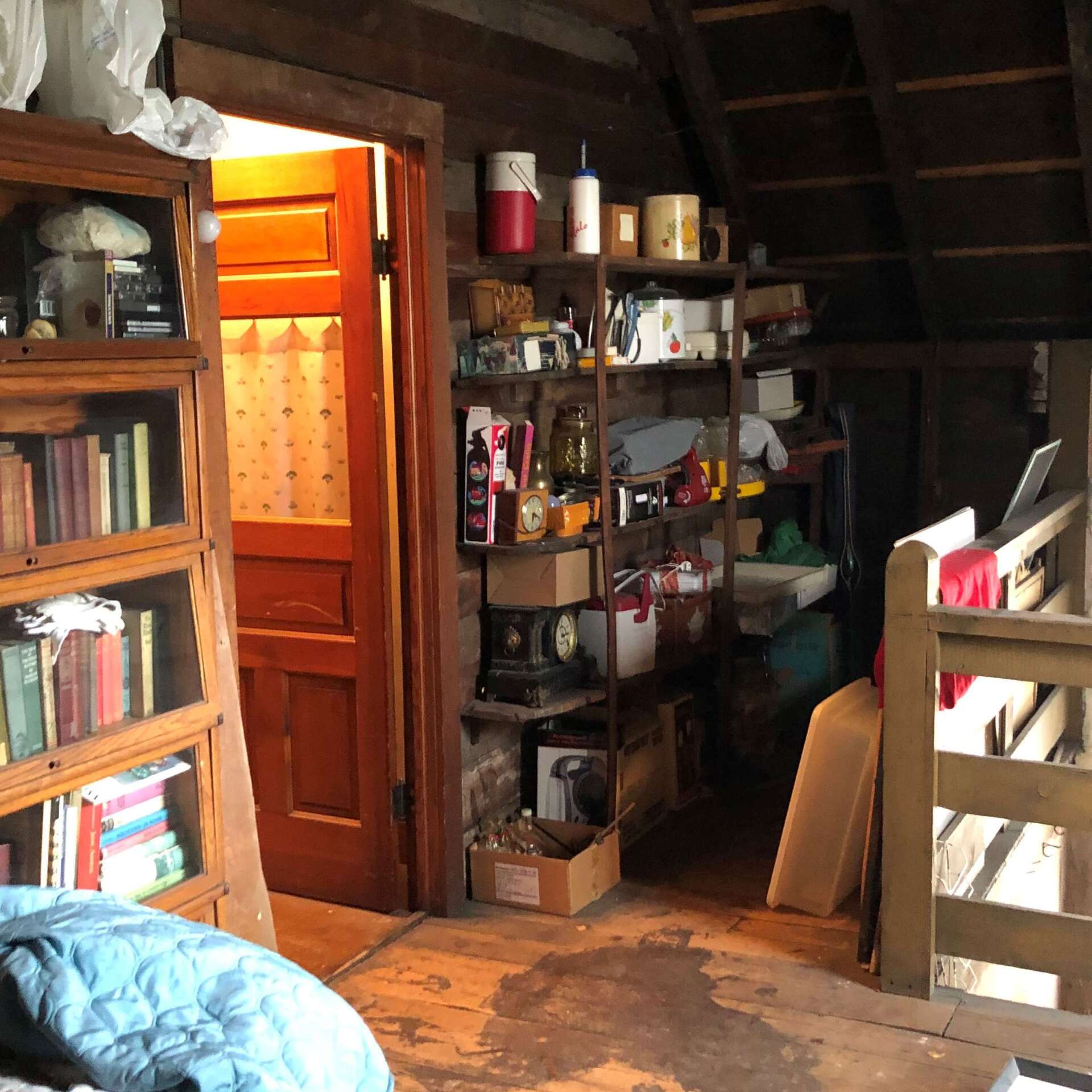 A room with a shelf full of books and a clock that says ' clock ' on it
