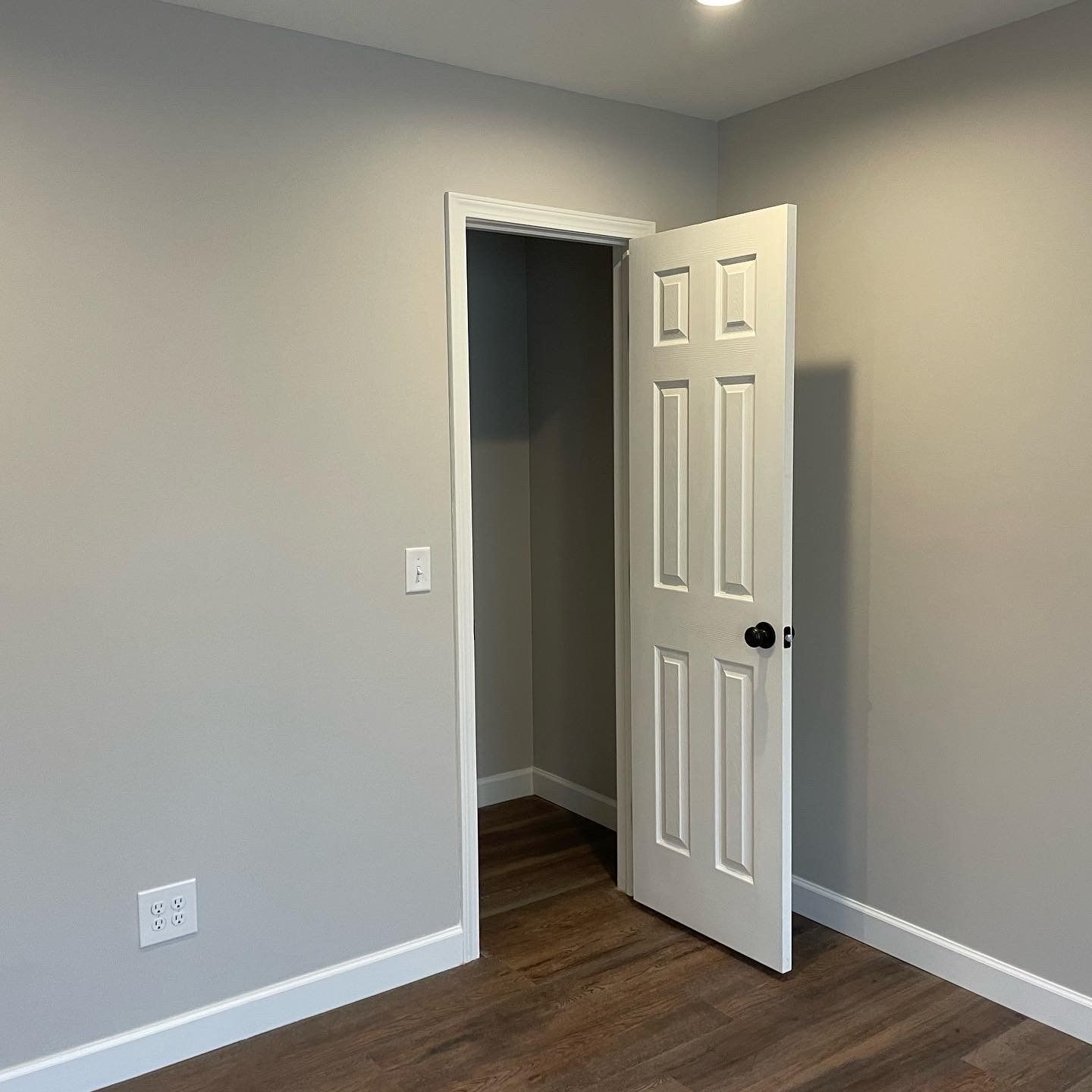 An empty room with a door that is open