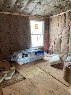 A room with a lot of insulation and a window.