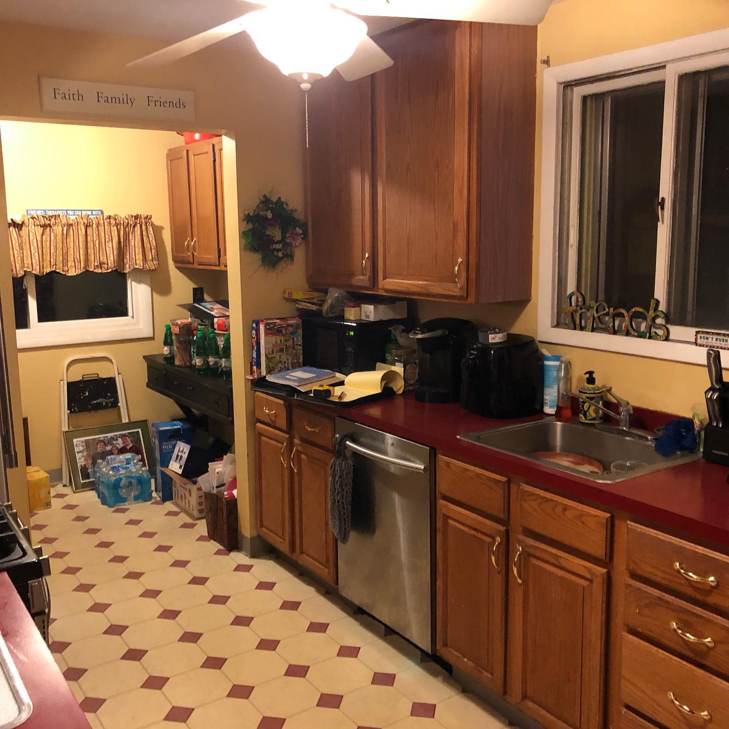 A kitchen with stainless steel appliances and wooden cabinets