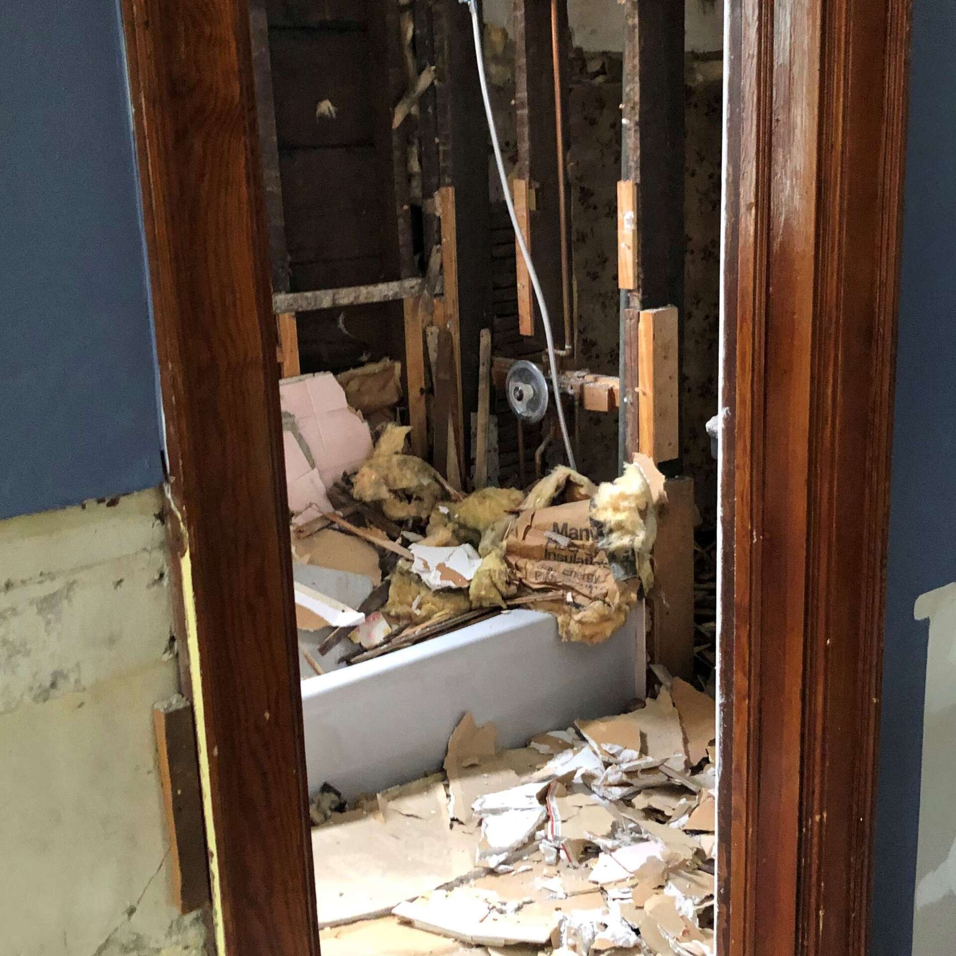 A bathroom with a bathtub that is being remodeled