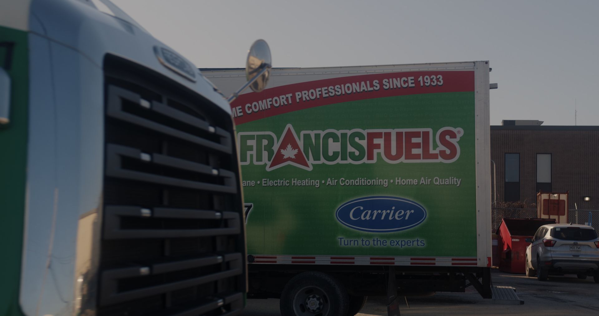 A green truck that says francisfuels on the side