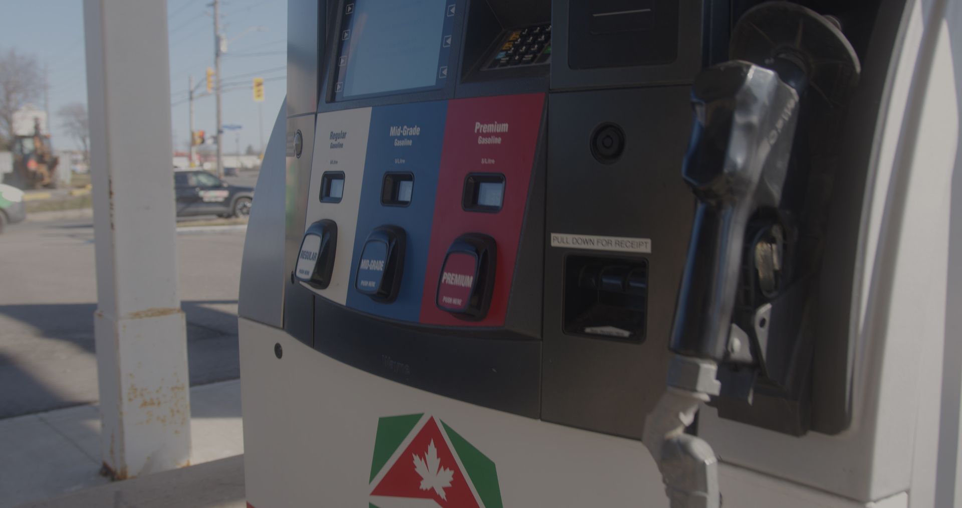 A close up of a gas pump at a gas station.