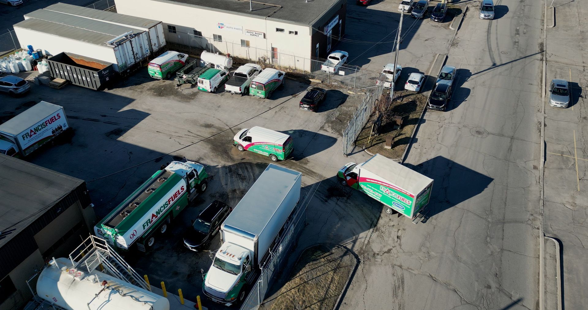 An aerial view of a lot of trucks parked in a parking lot.