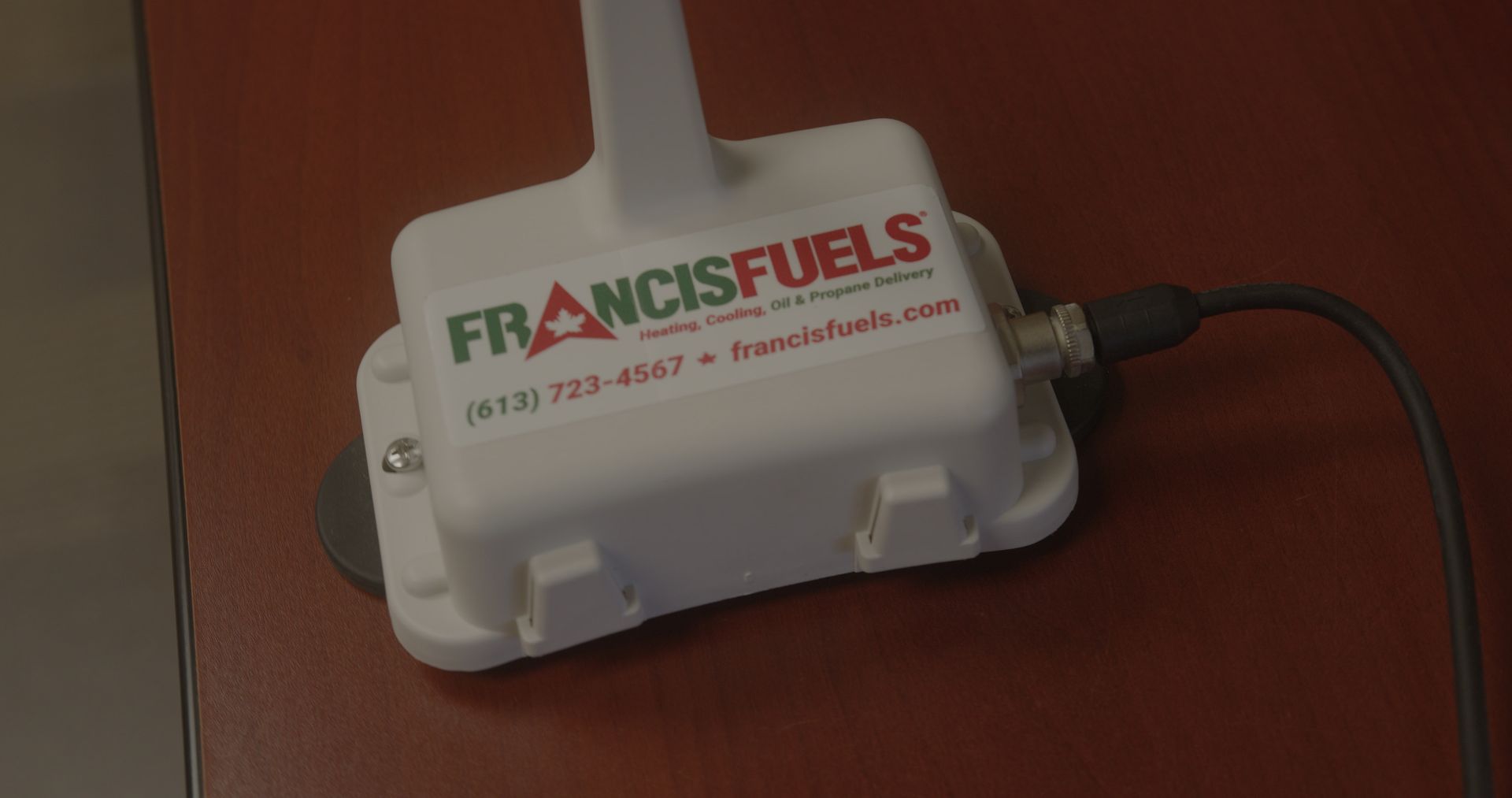 A white box with the words francisfuels written on it is sitting on a wooden table.