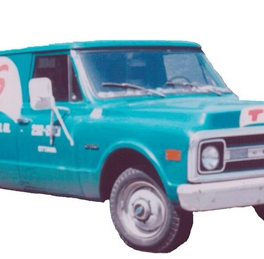 A blue gmc truck with the number 5 on the side