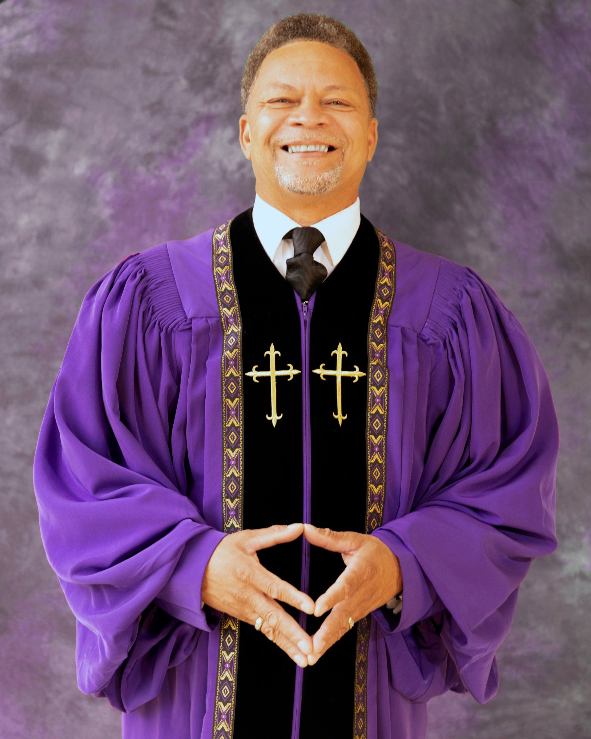A man in a purple robe with two crosses on it