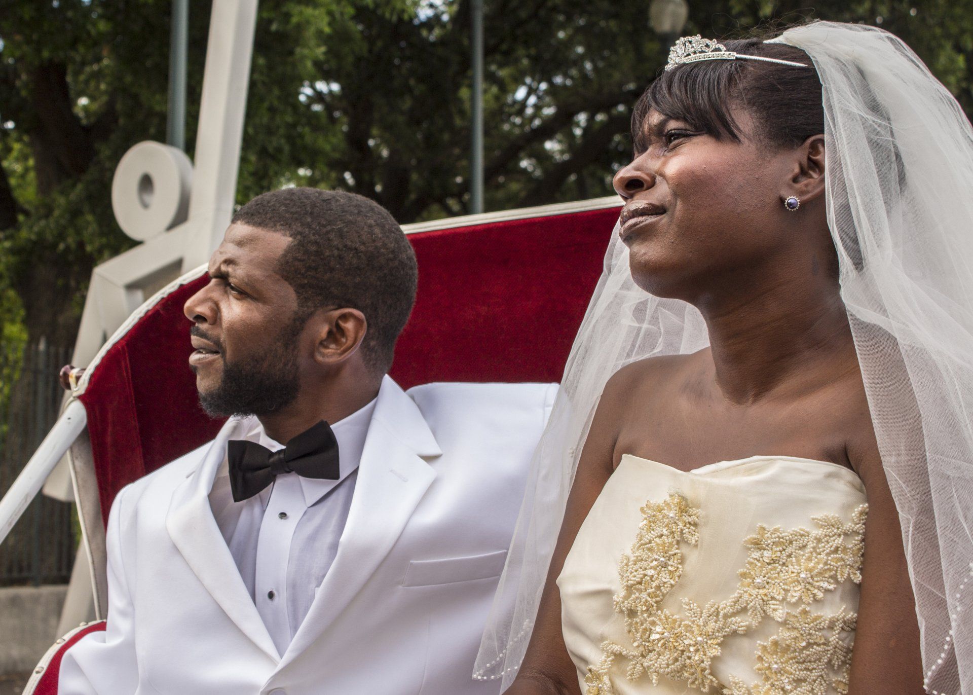 A bride and groom are posing for a picture on their wedding day