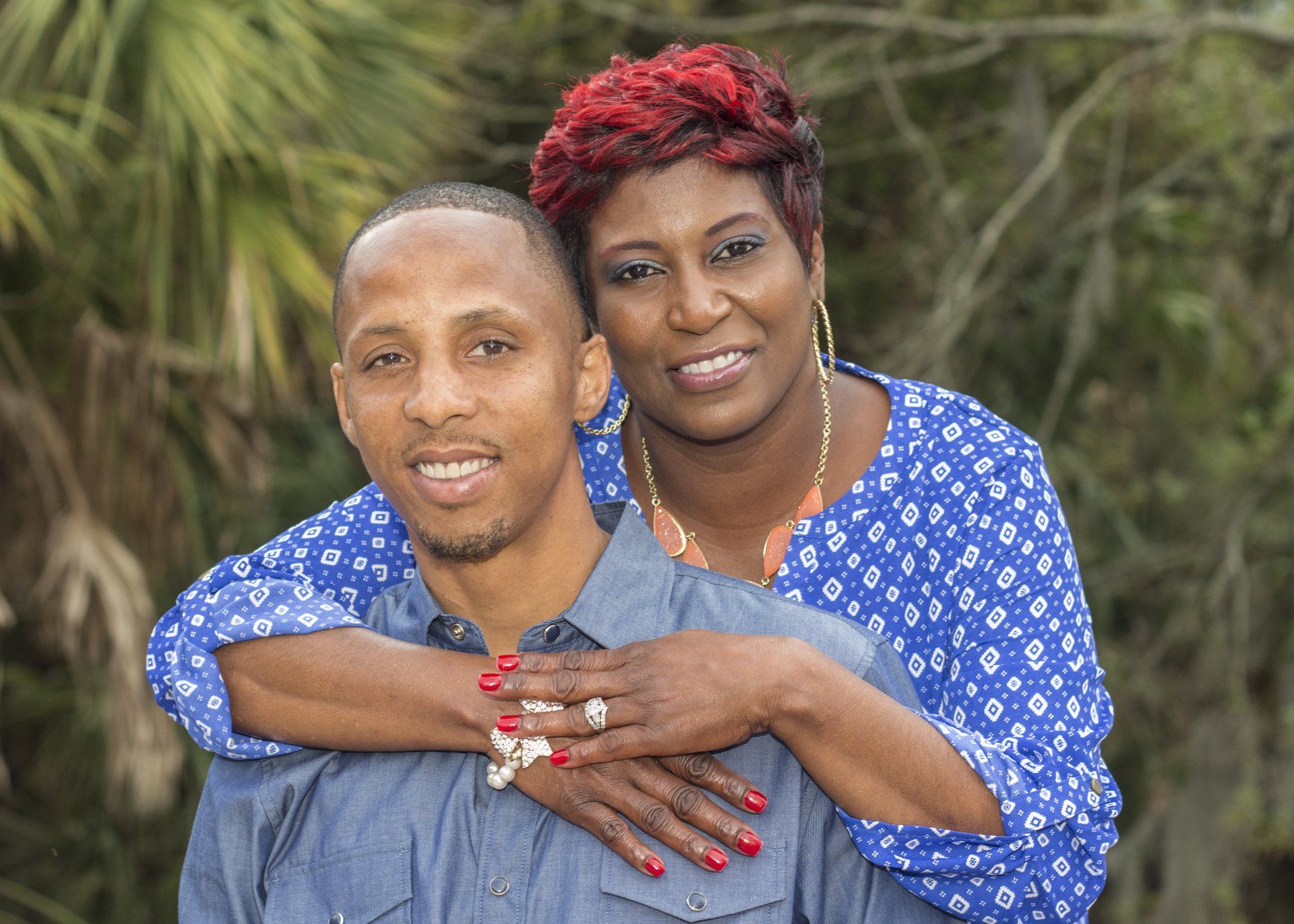 A man and a woman are posing for a picture together.
